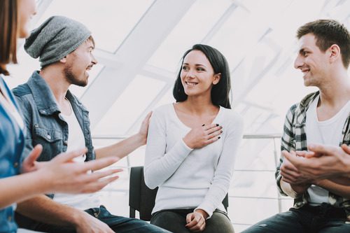 group-of-young-people-sit-in-a-support-circle