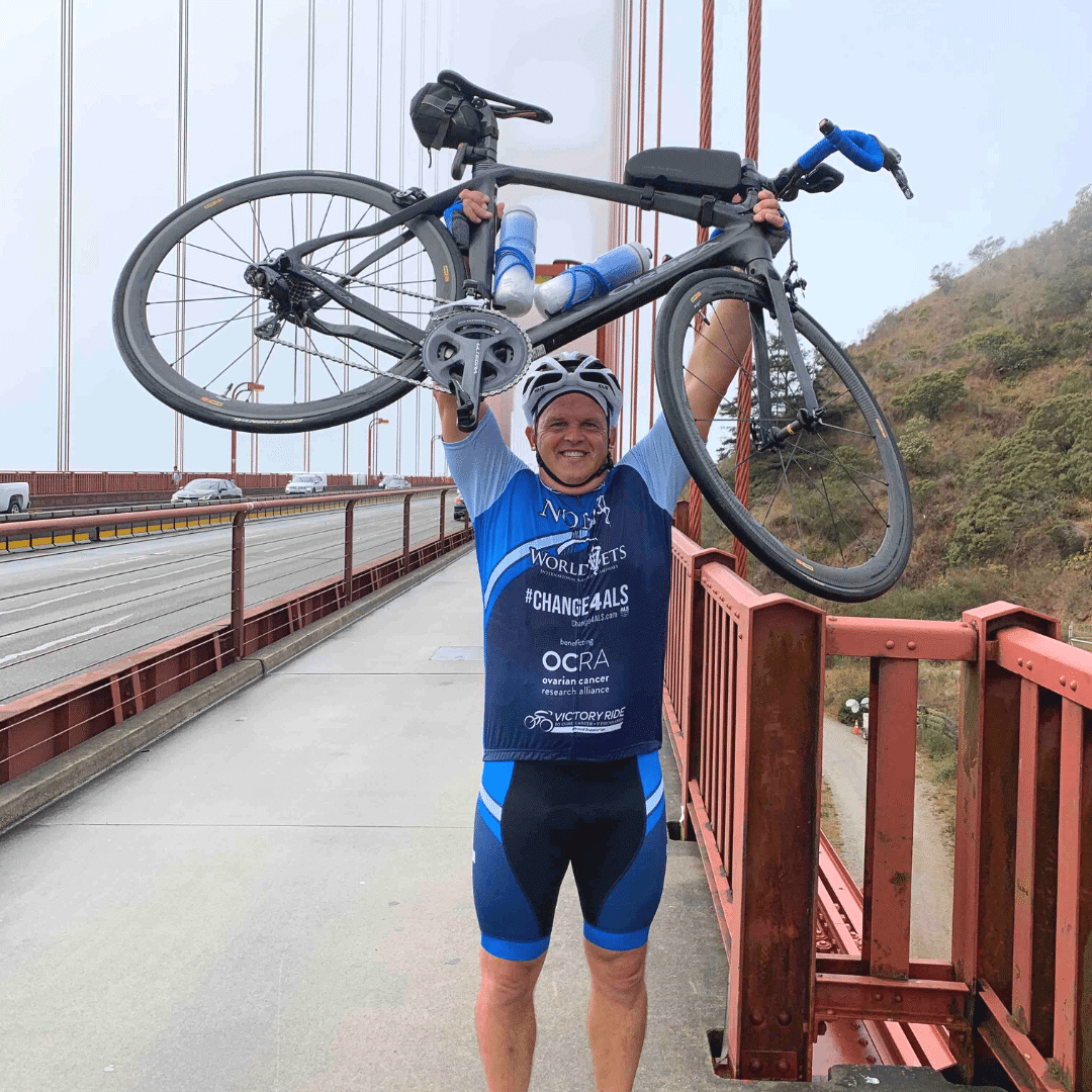 Man Holding Up Bike